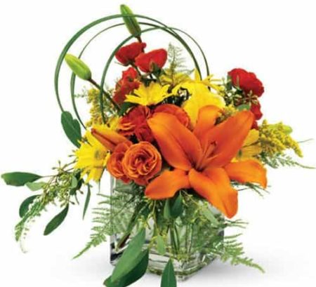orange spray roses, yelow daisies and orange lilies. Say "Happy Birthday" with this charming, stylish floral arrangement.